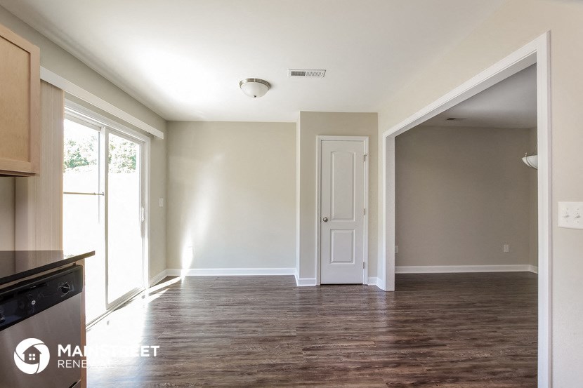 the kitchen and living room of a new home