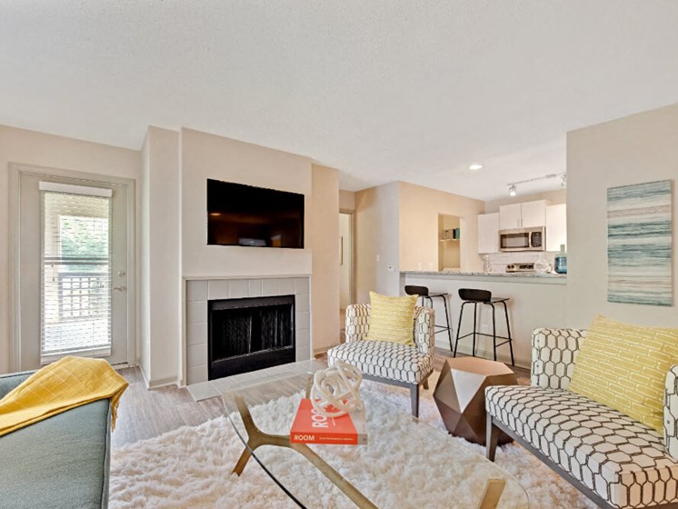 Living Room with Fireplace and Kitchen View at Crosstown at Chapel Hill, Chapel Hill, 27517