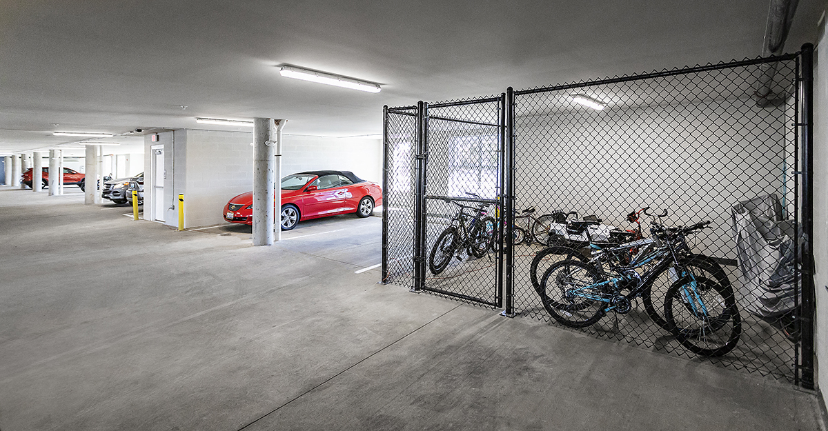 a group of bikes parked in a parking garage