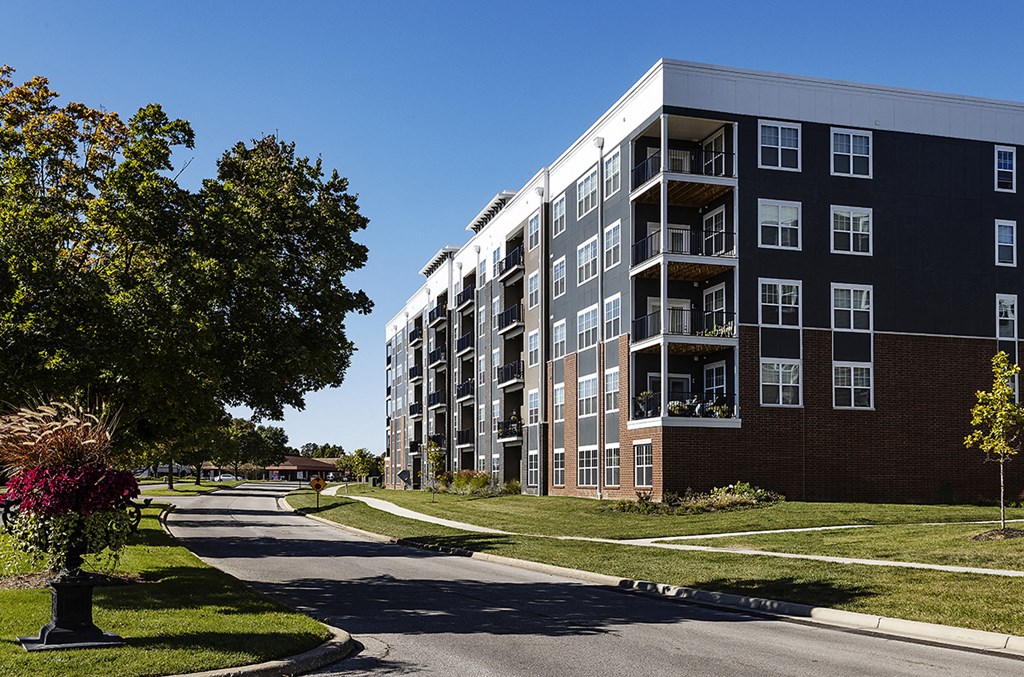 an apartment building on the side of a street