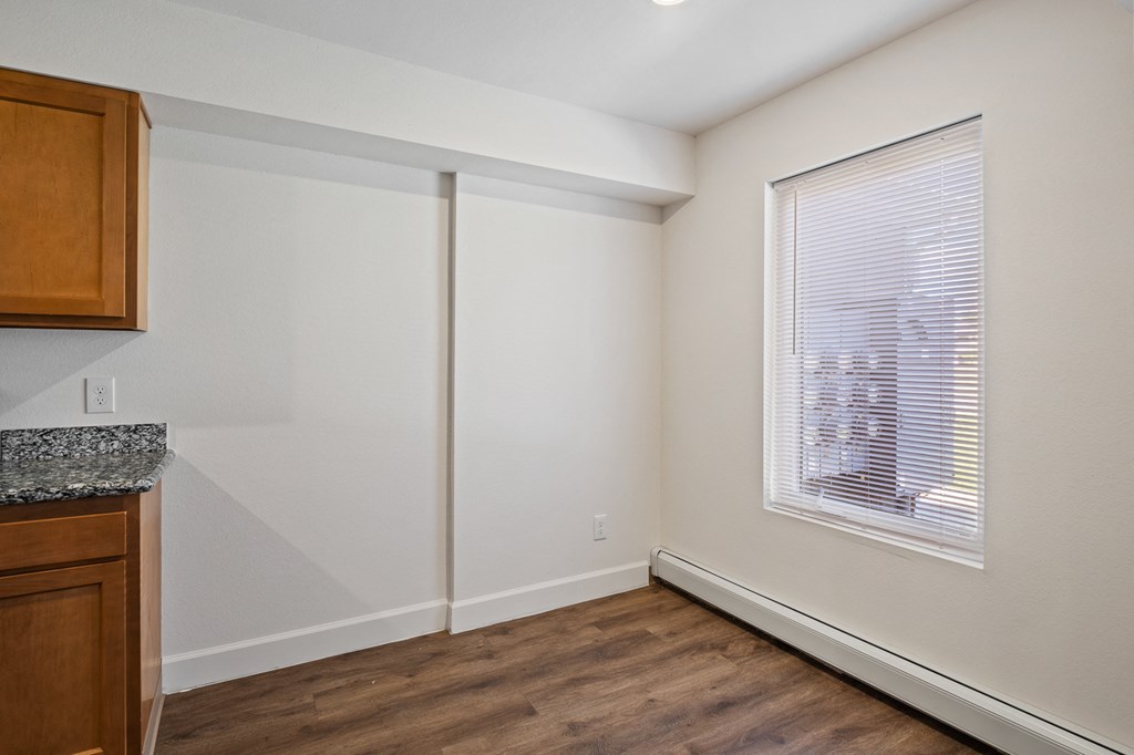 A room with a window and a counter top.