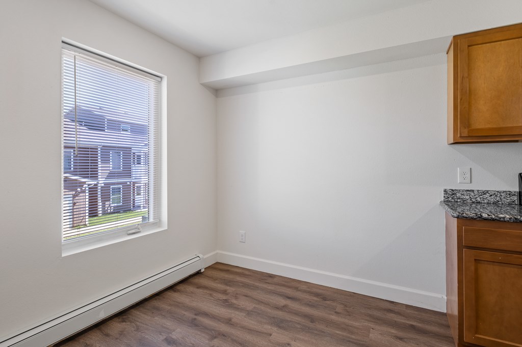 A room with a window and a counter.