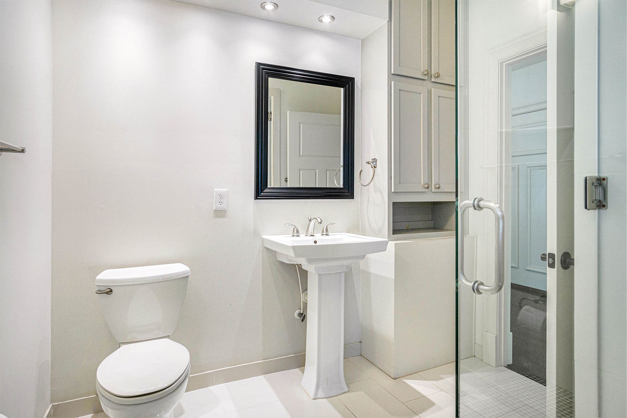 a bathroom with a toilet sink and a shower