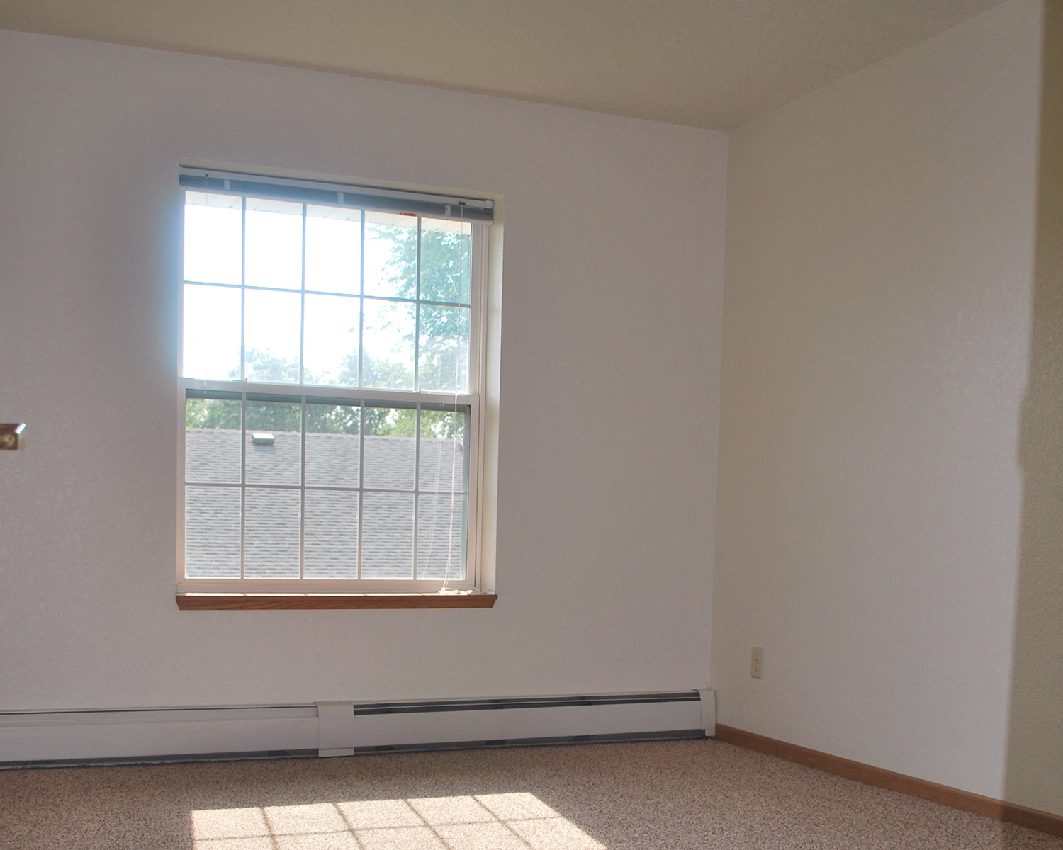 an empty room with a window in it