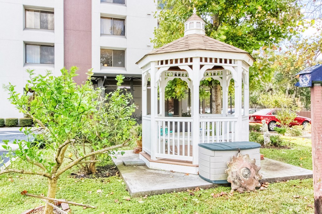 gazebo surrounded by lush green landscaping