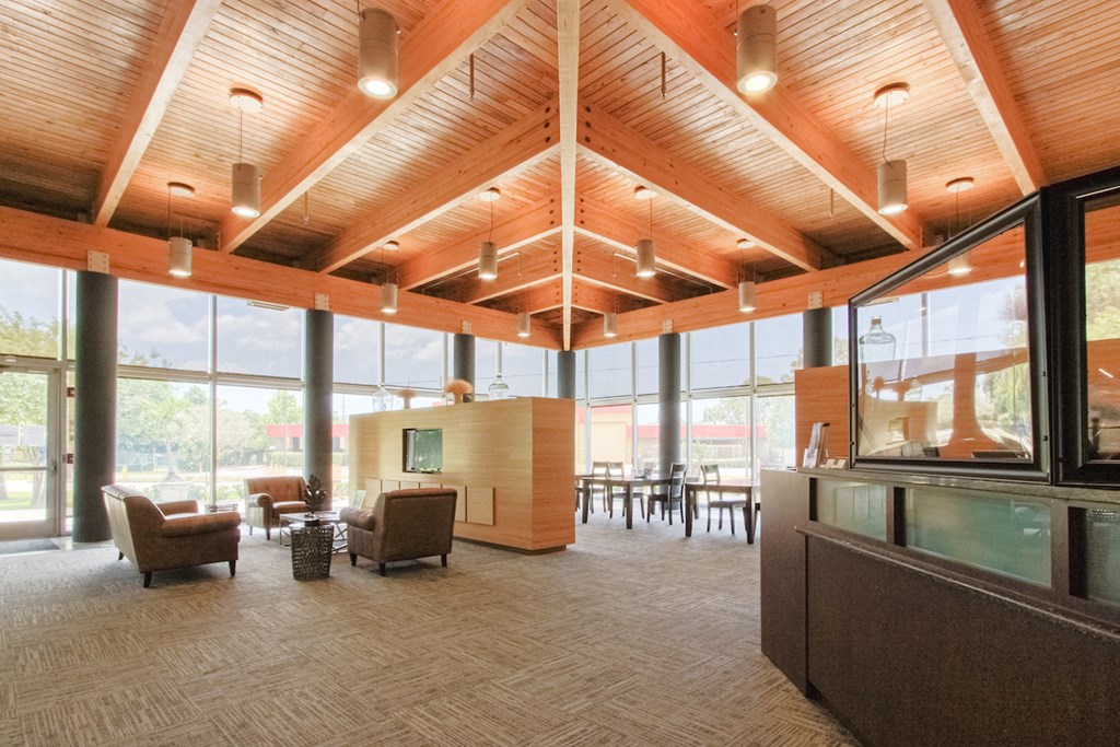 lobby with high ceiling, ceiling to floor windows, and seating