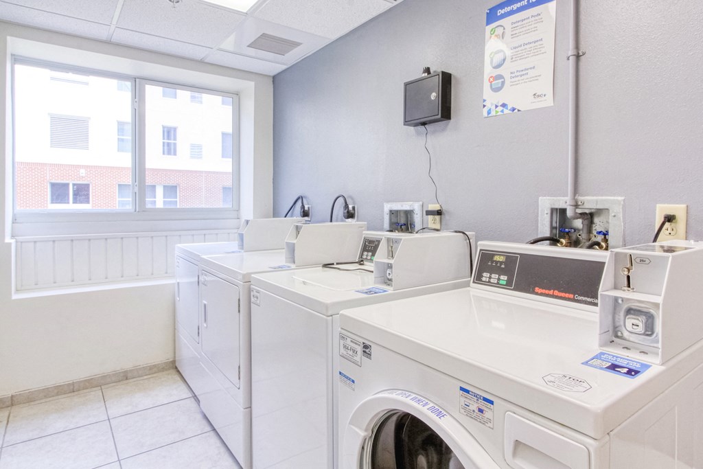 laundry center with washers and dryers