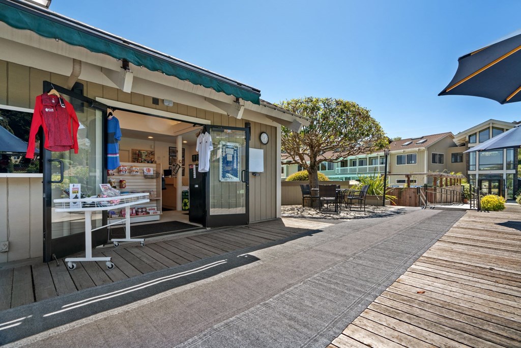 the store is on the side of the sidewalk