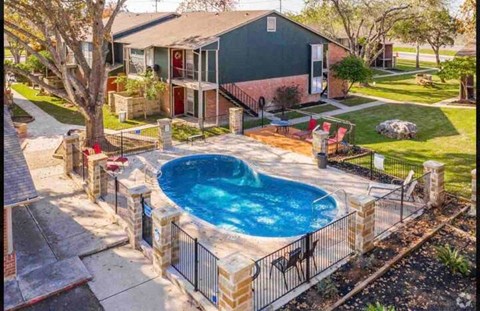 a small pool in the backyard of a house
