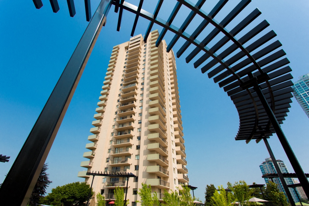 a tall building with a blue sky in the background
