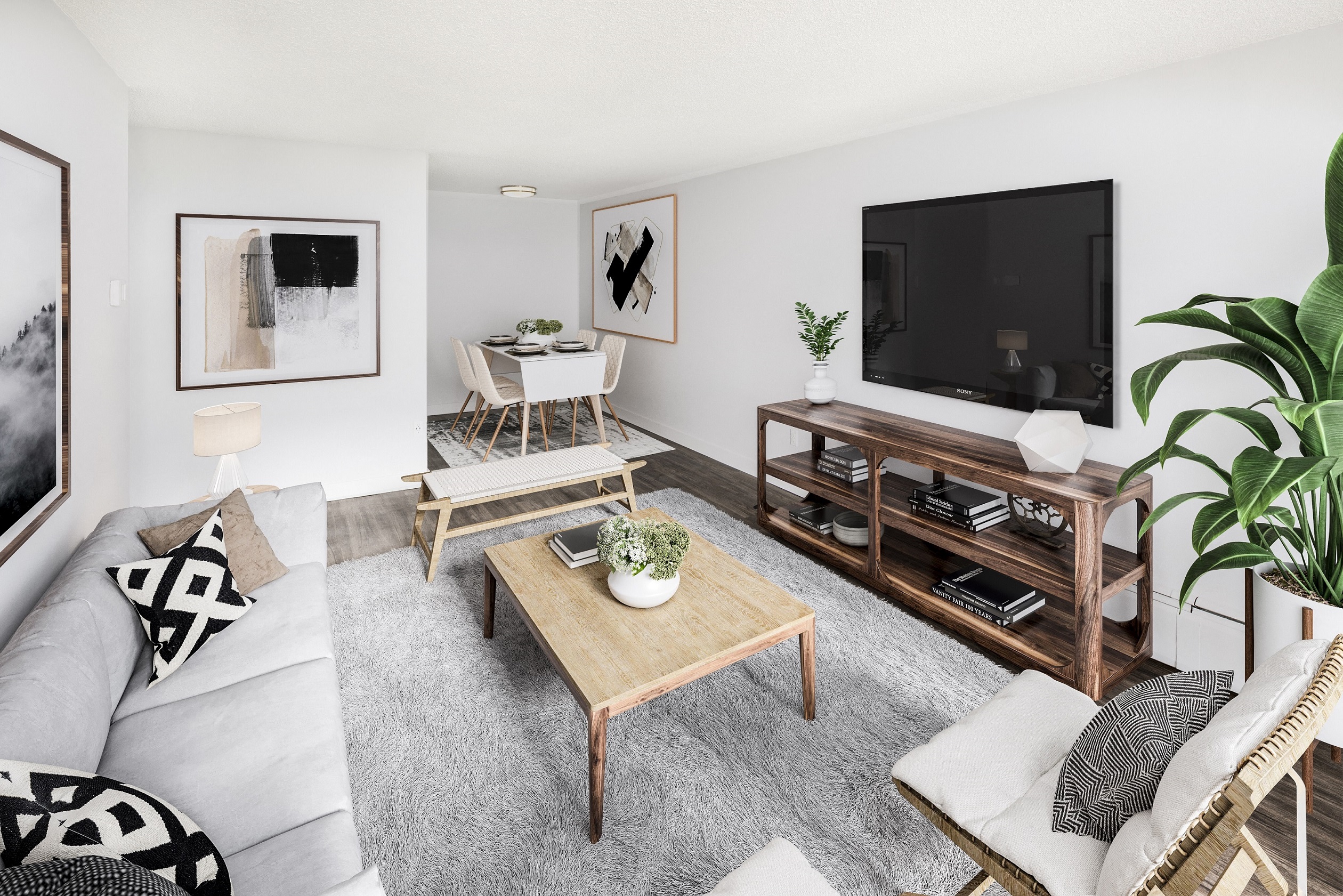 a living room with a couch and a table and a television