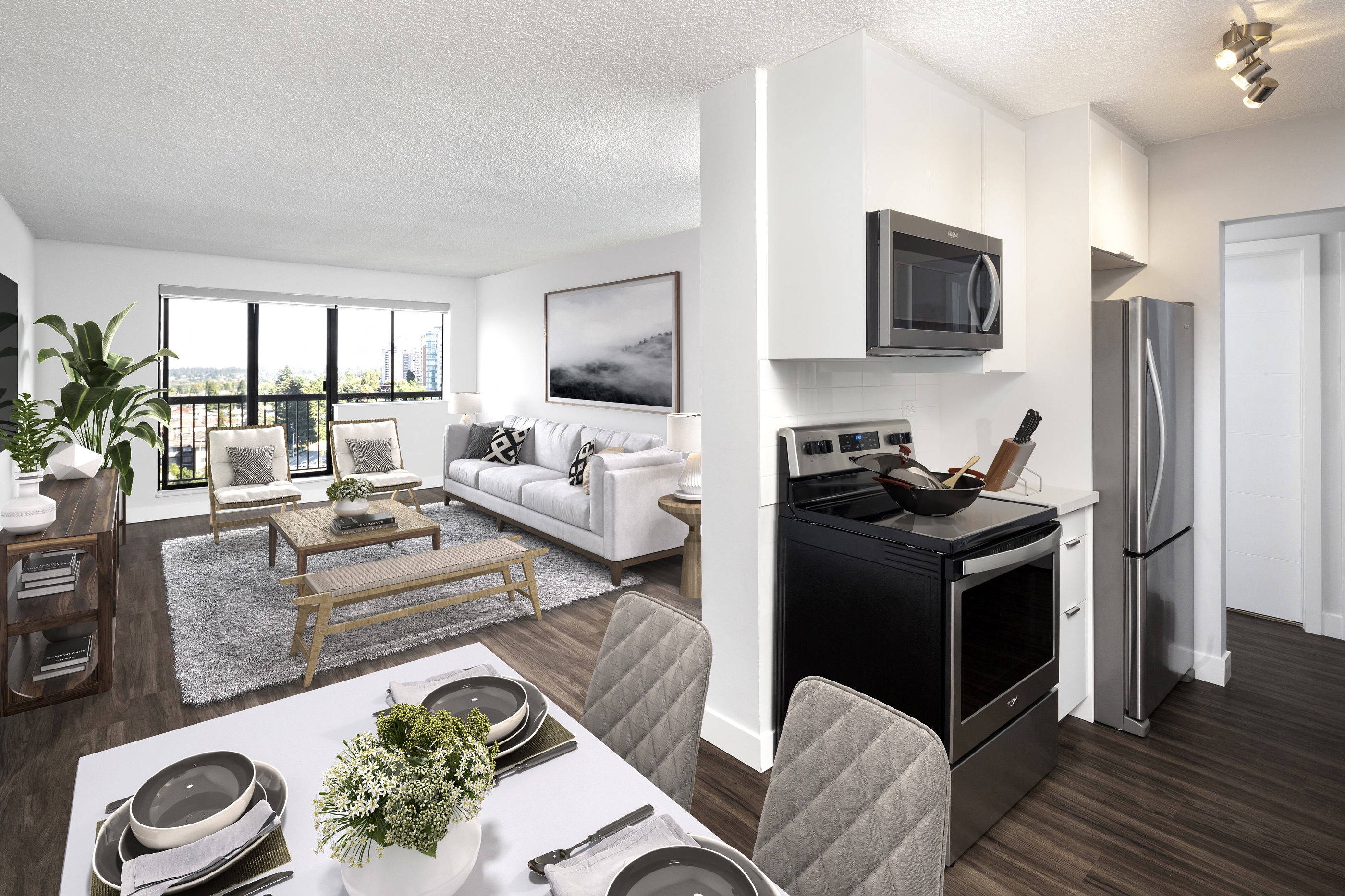 a living room and a kitchen with a table and chairs