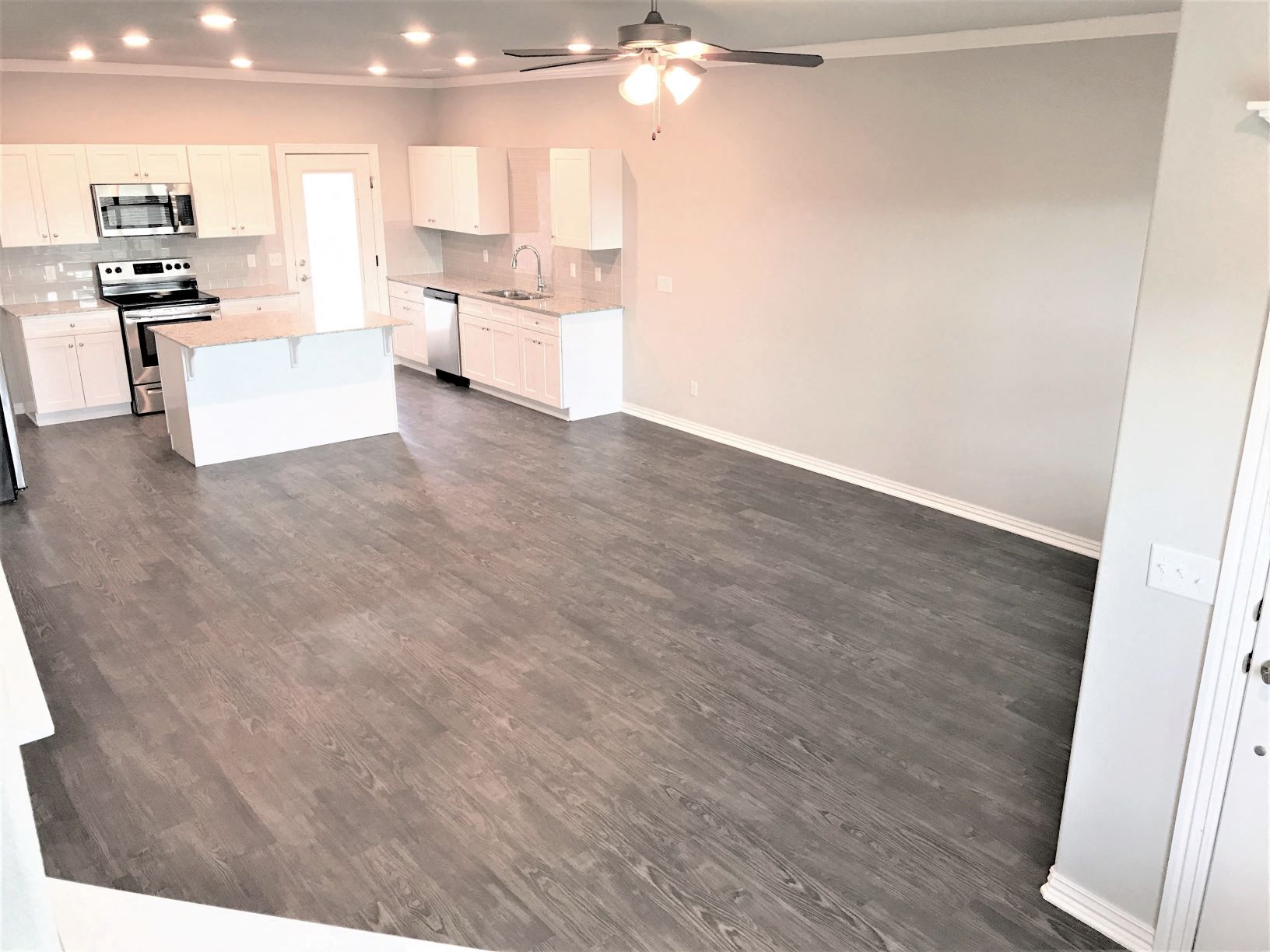 B3 (1-car) Living Dining open concept with laminate wood flooring