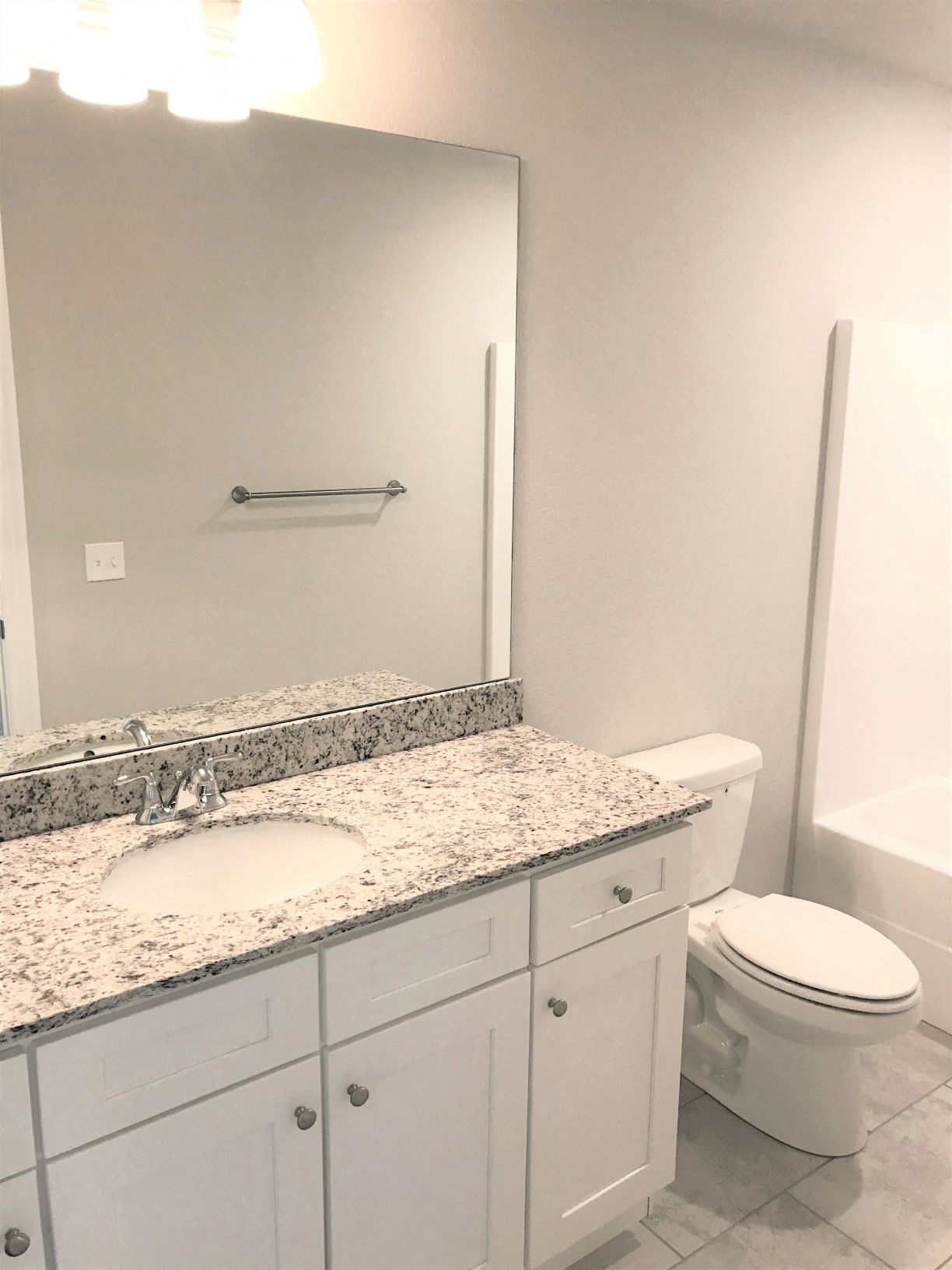 B3 (1-car) Master Bath with granite countertops, sink, toilet, and shower