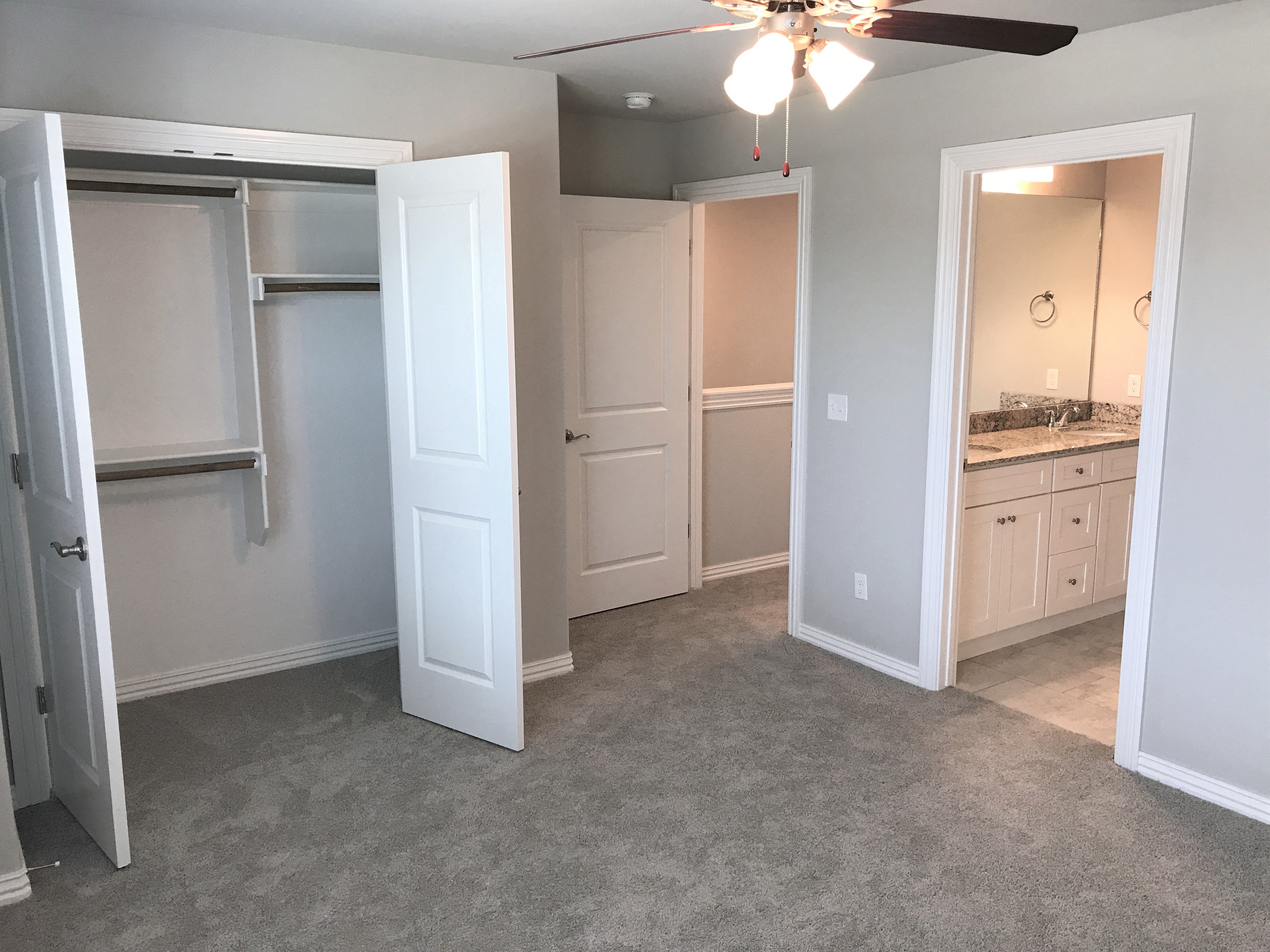 C1 (1-car) Master Bed with carpet facing bathroom and closet