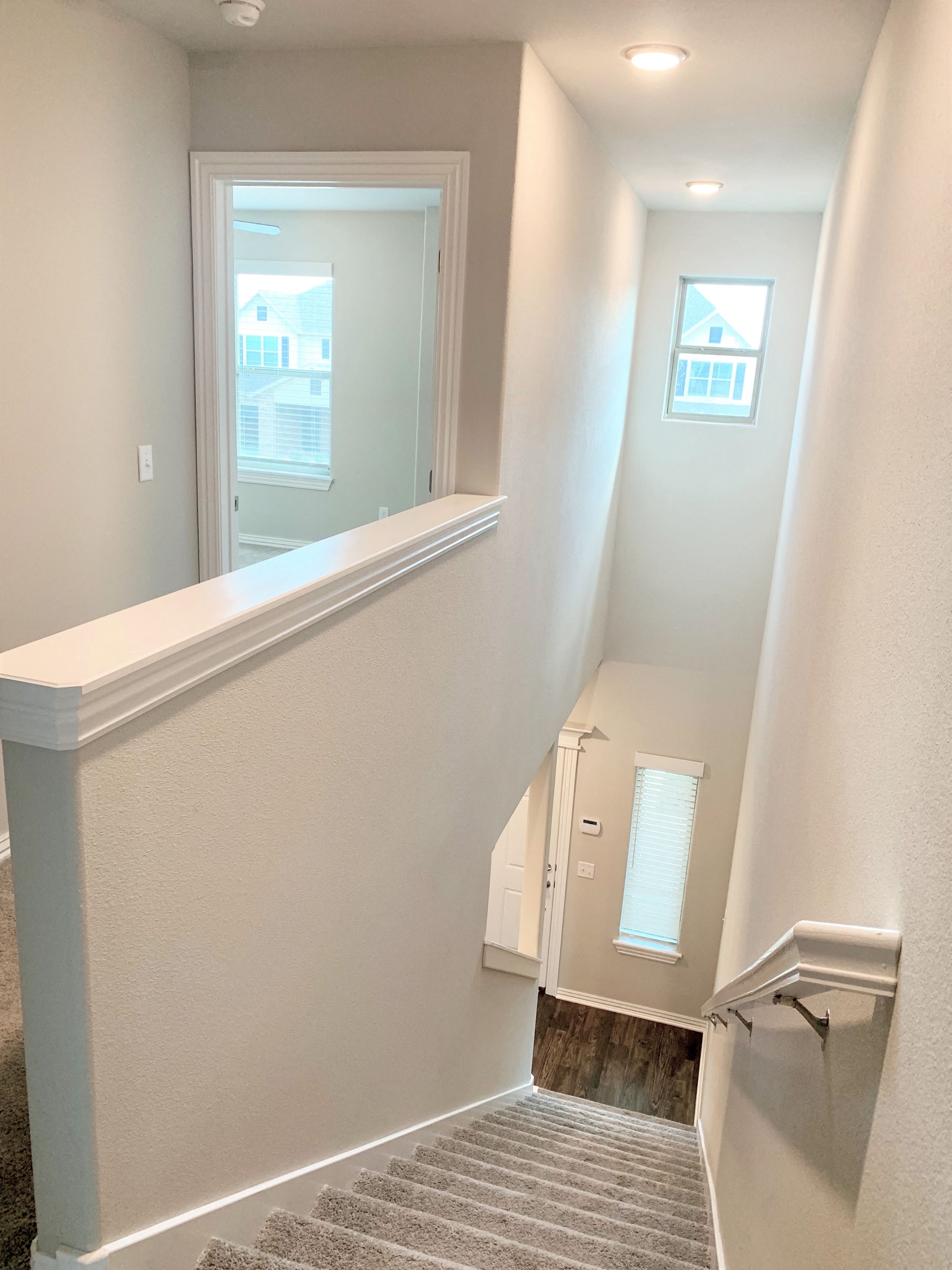 C1 (1-car) top of stairs looking down toward entry door