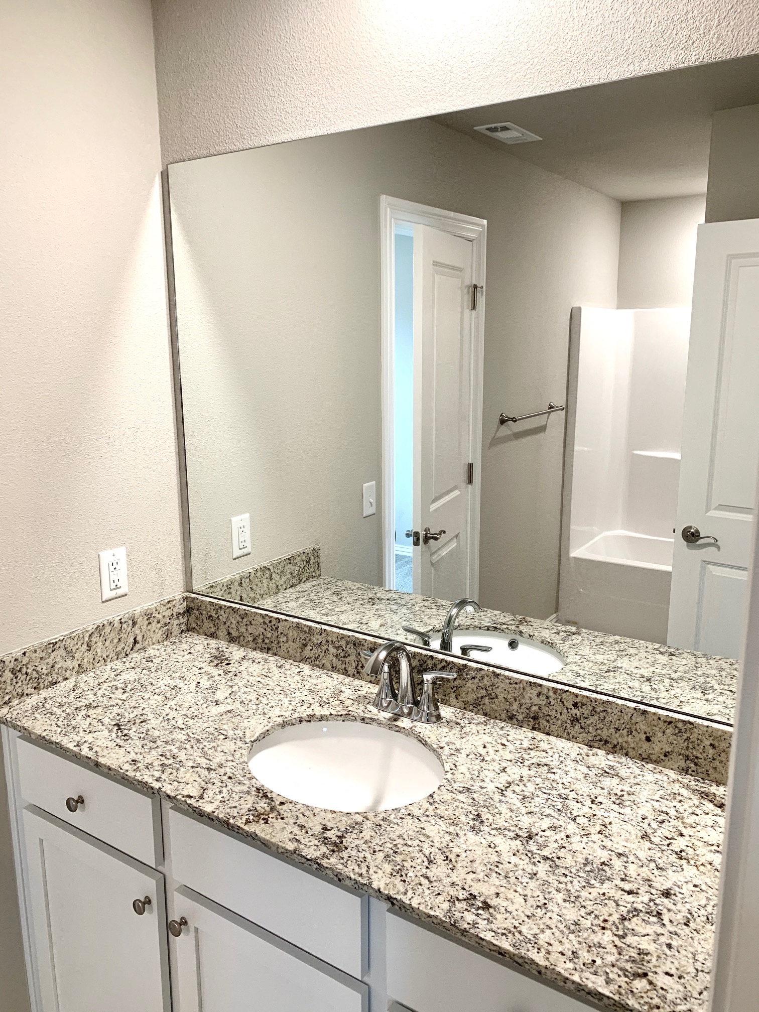 C1 (2-car) Guest Bath with granite countertops