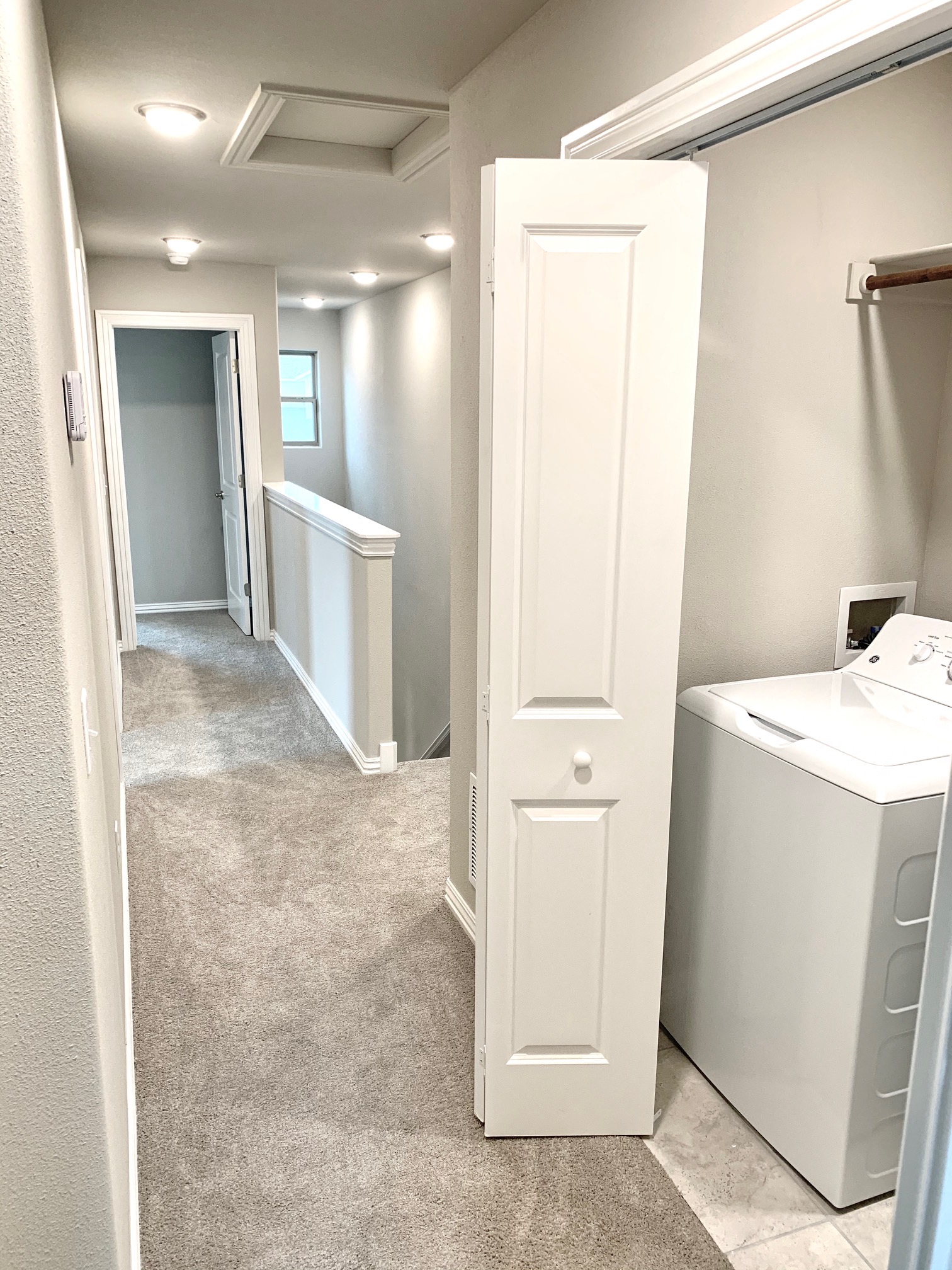 C1 (2-car) Upstairs Hallway by washer and dryer