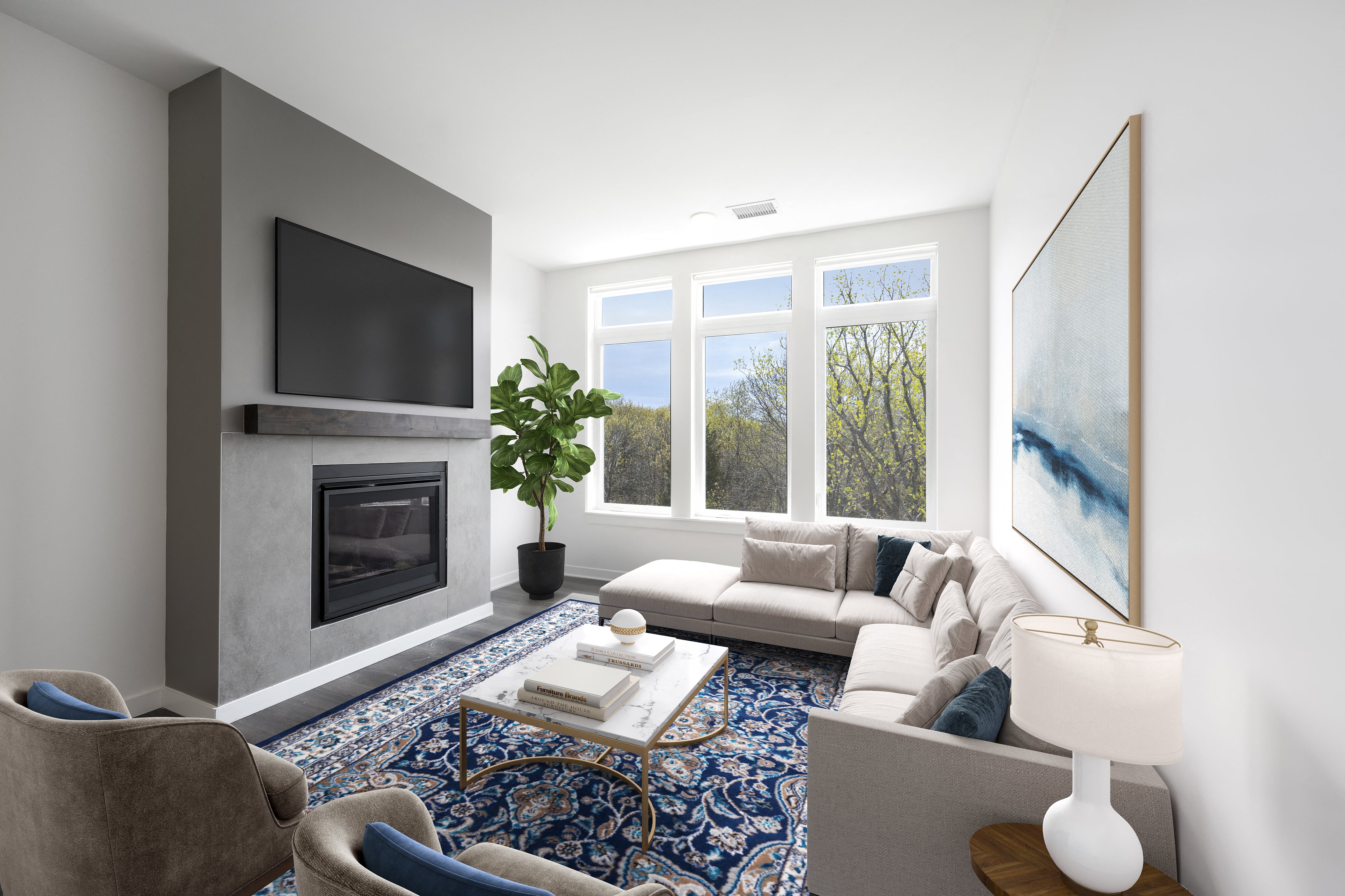 A modern living room with a fireplace, a sofa, a coffee table, and a painting on the wall.