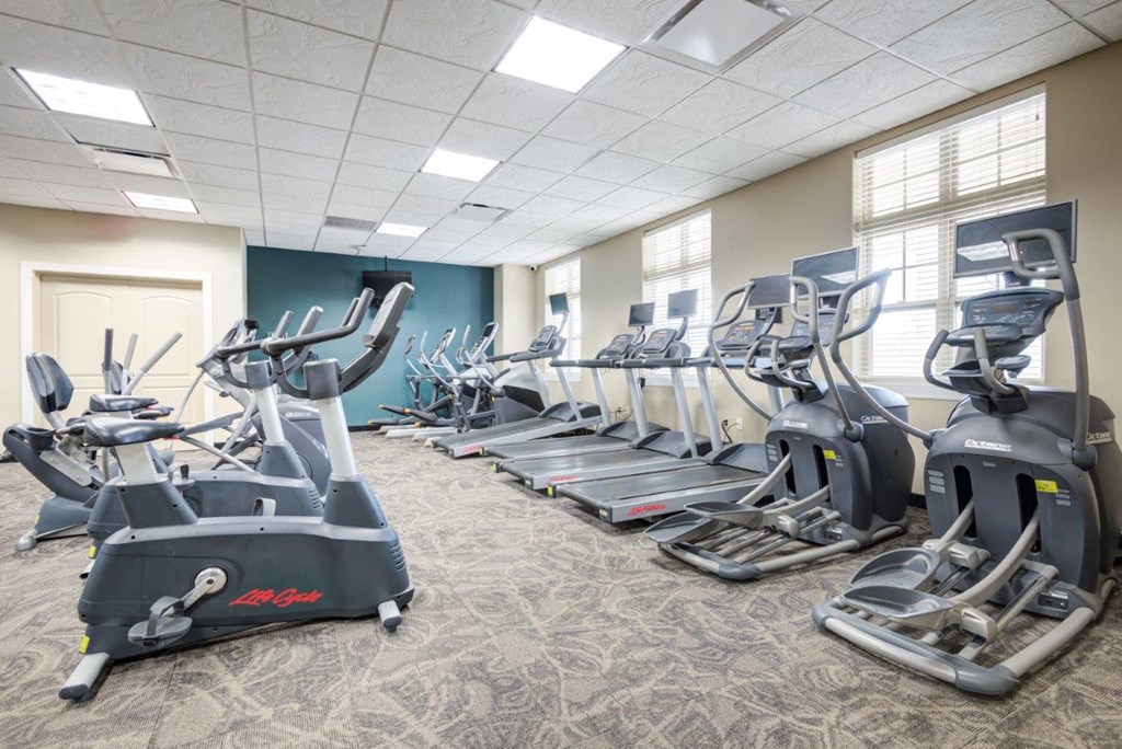 a room filled with cardio equipment and exercise machines
