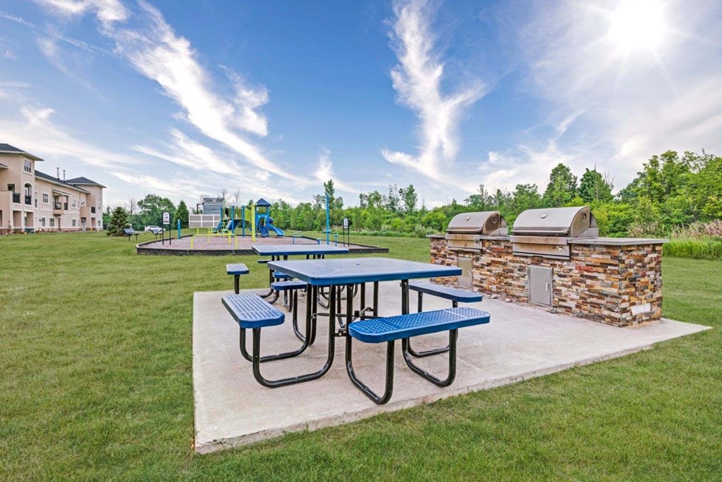 our picnic tables are next to our playground and a fire pit
