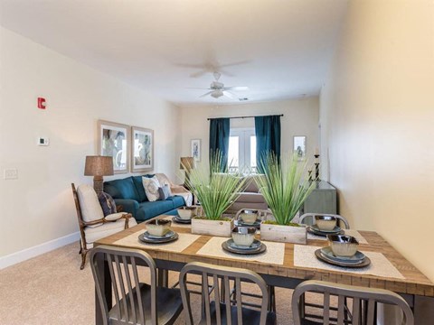 a dining room with a table and chairs