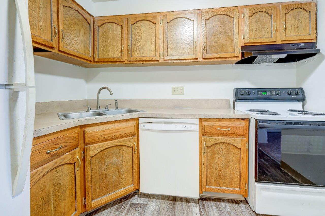 Kitchen with White Appliances with Oak Cabinets