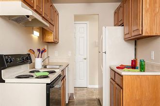 a kitchen with a stove and a refrigerator