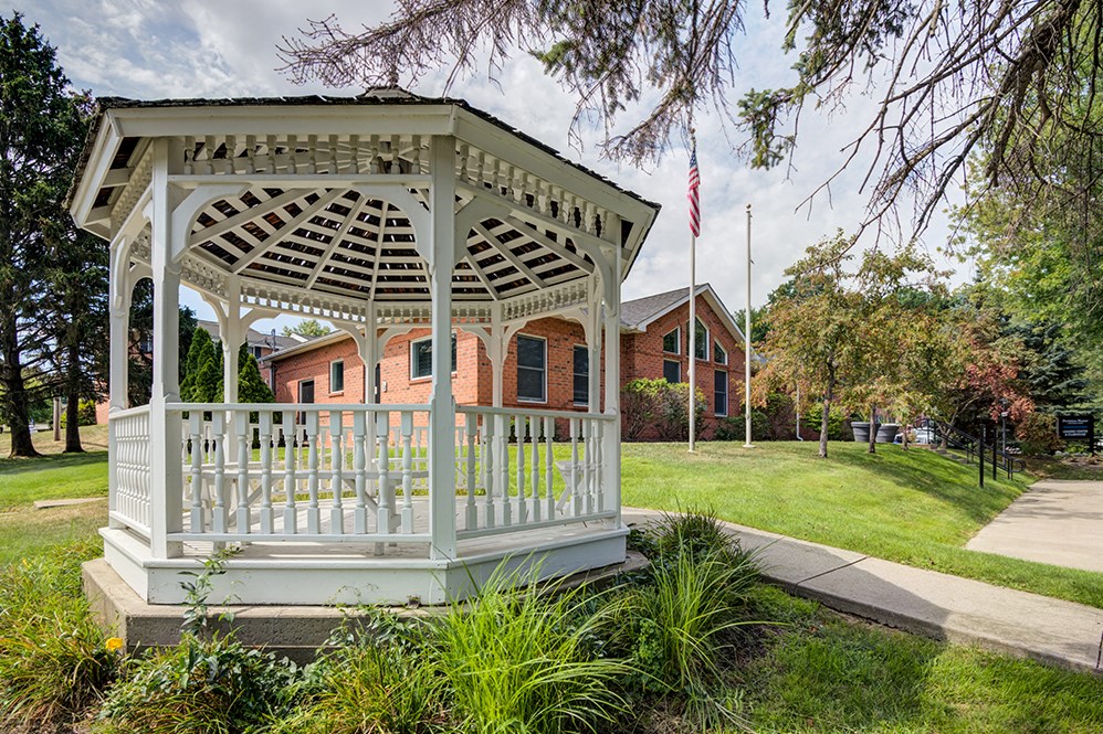 a gazebo in front of a building