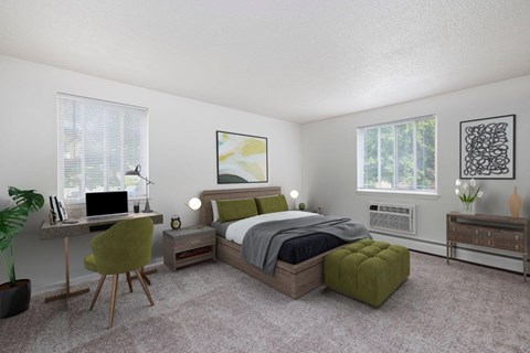 a bedroom with a bed and a desk with a computer
