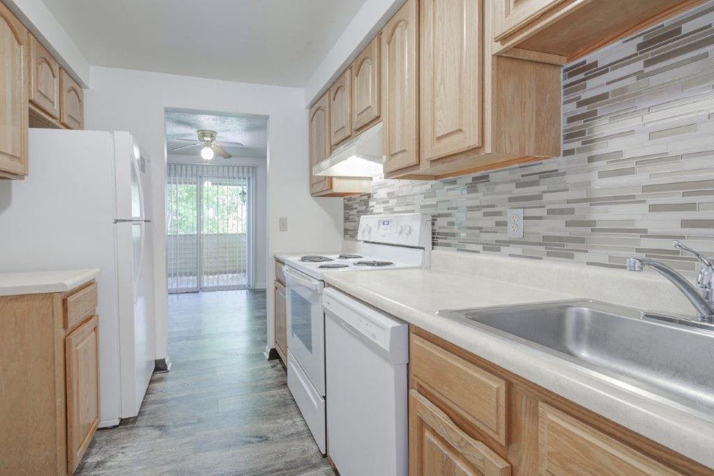 Kitchen with White Appliances with Oak Cabinets