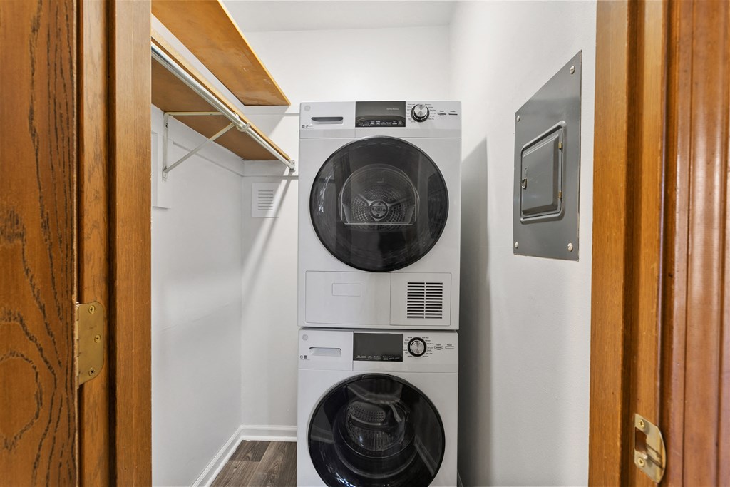 a small laundry room with a washing machine and a dryer