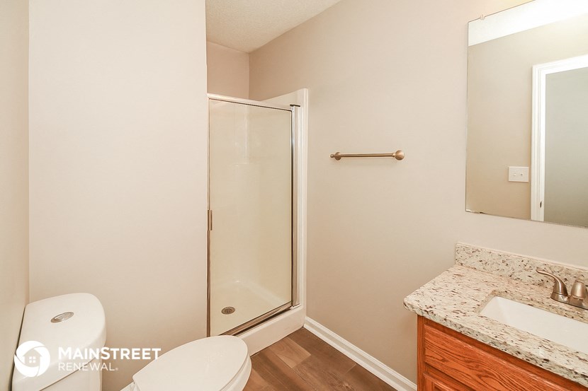 a small bathroom with a toilet and a shower