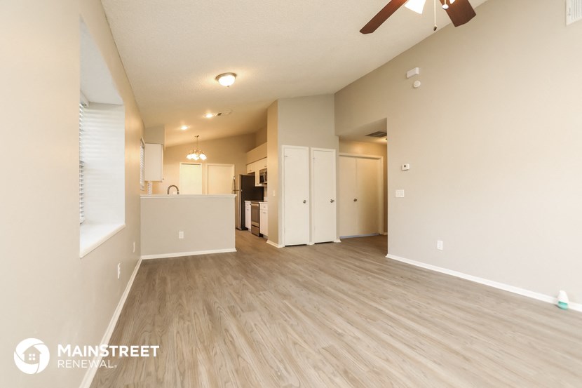 the living room and kitchen of an apartment
