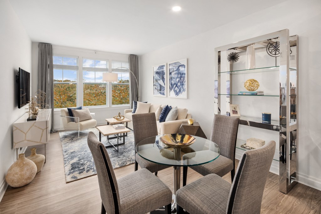 a living room with a table and chairs and a couch