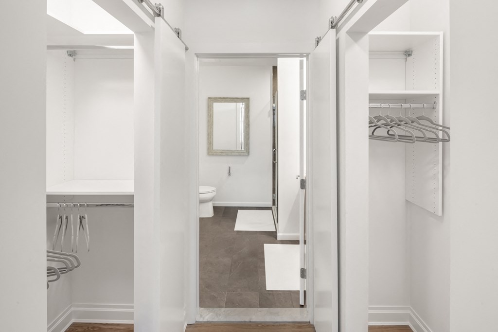 a small bathroom with a shower and a sink and a toilet