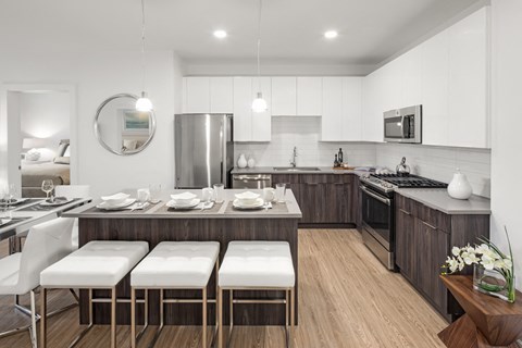 a kitchen and dining area with a table and chairs