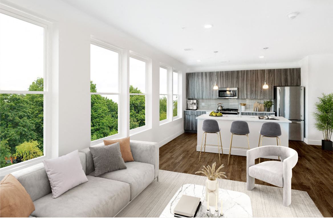 a living room with a kitchen and a couch