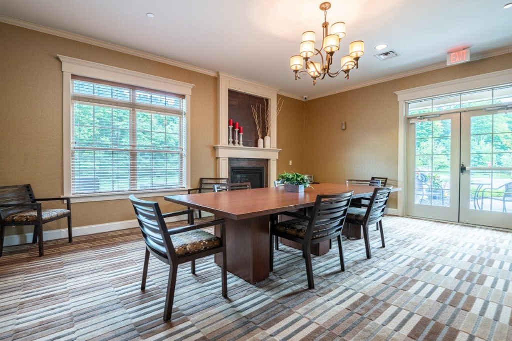 a dining room with a table and chairs and a fireplace