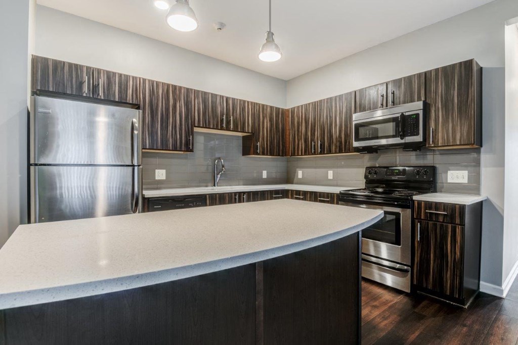 a kitchen with stainless steel appliances and a counter top