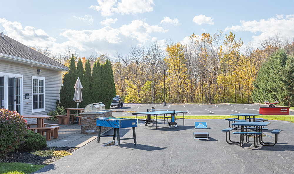 outdoor game area with foosball and ping pong