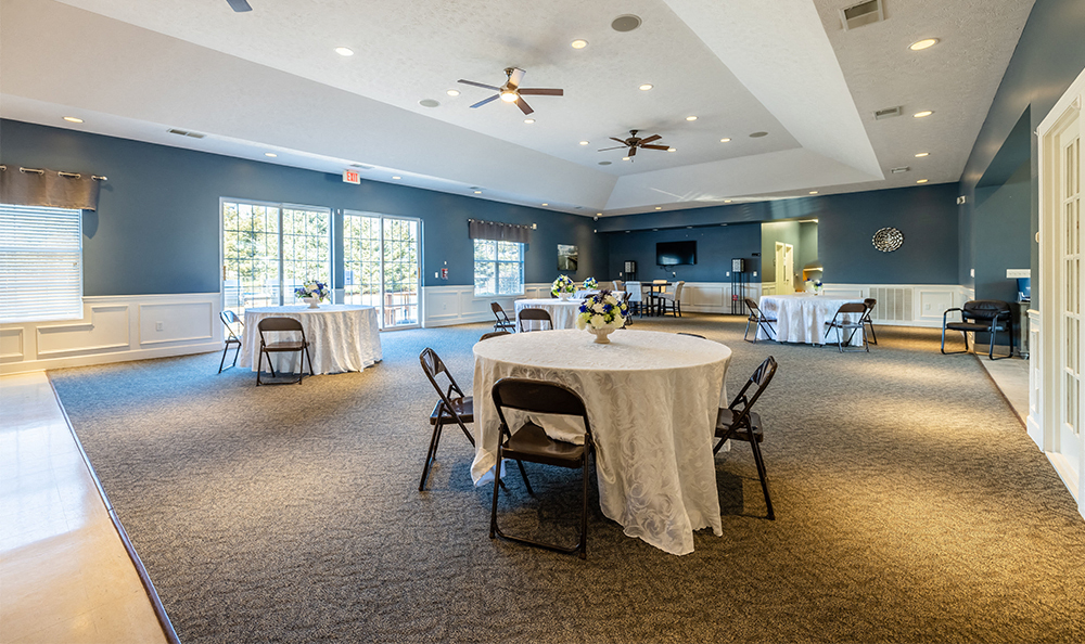 resident clubroom with tables throughout