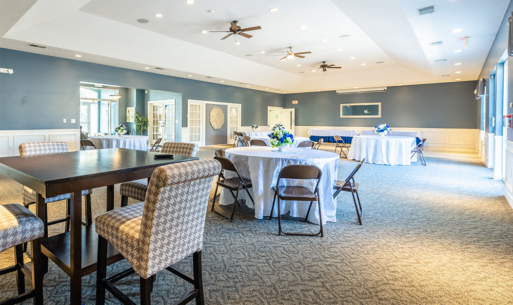 resident clubroom with tables throughout