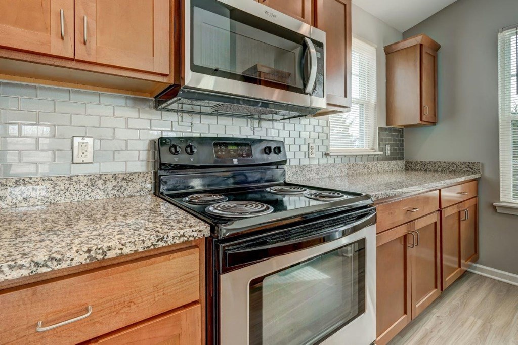 a kitchen with a stove and a microwave
