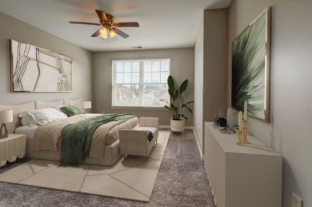 a bedroom with a bed and a ceiling fan