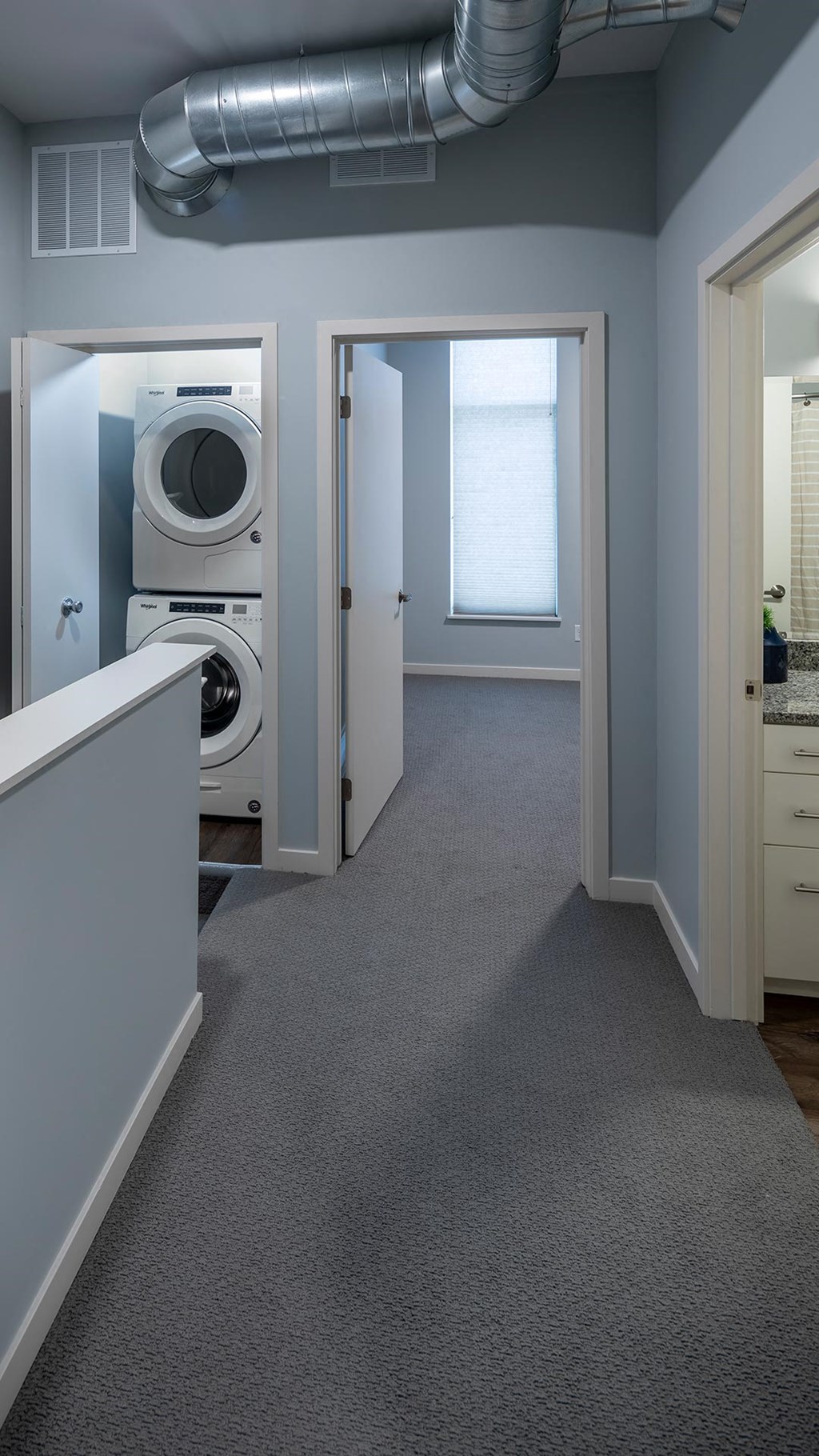 a laundry room with a washer and dryer in it
