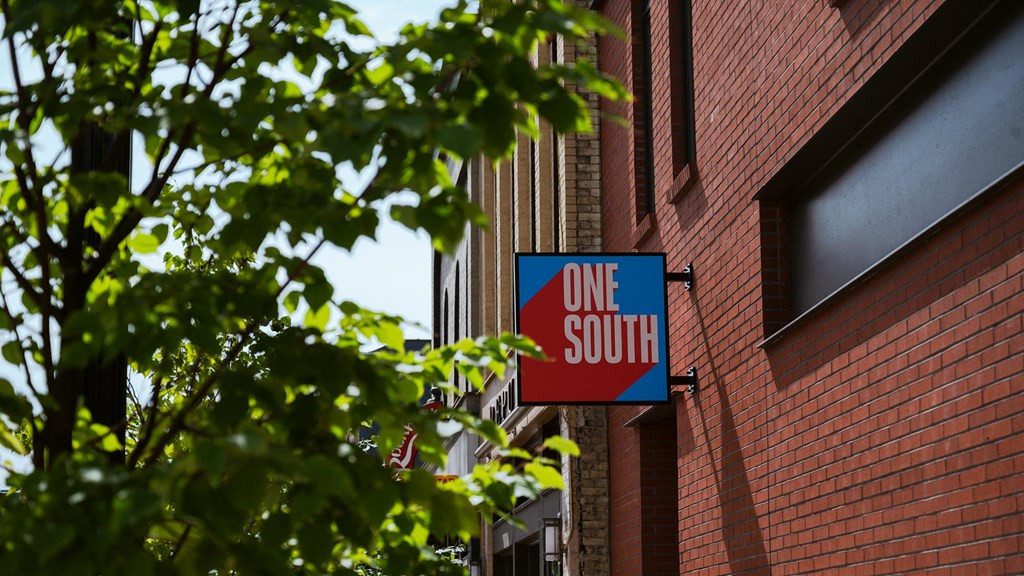 a one south sign on the side of a brick building