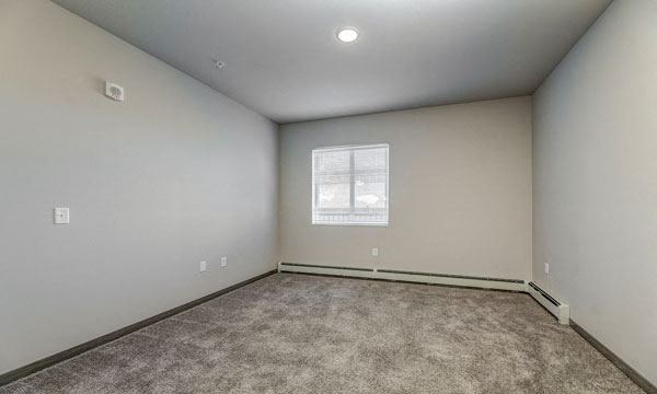 an empty room with a window in it