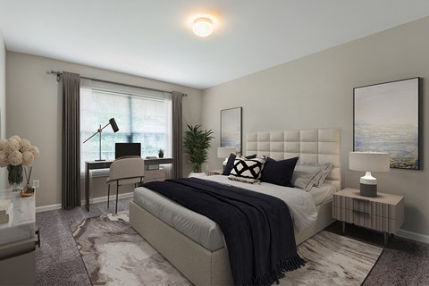 A bedroom with a large bed and a window with curtains.