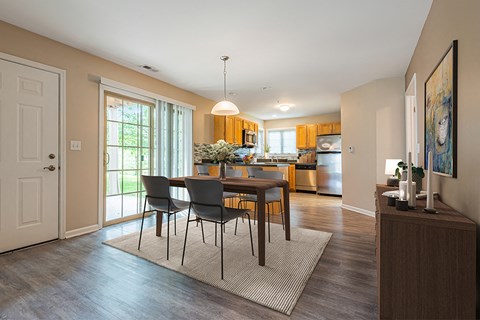 A dining room with a table and chairs is shown.
